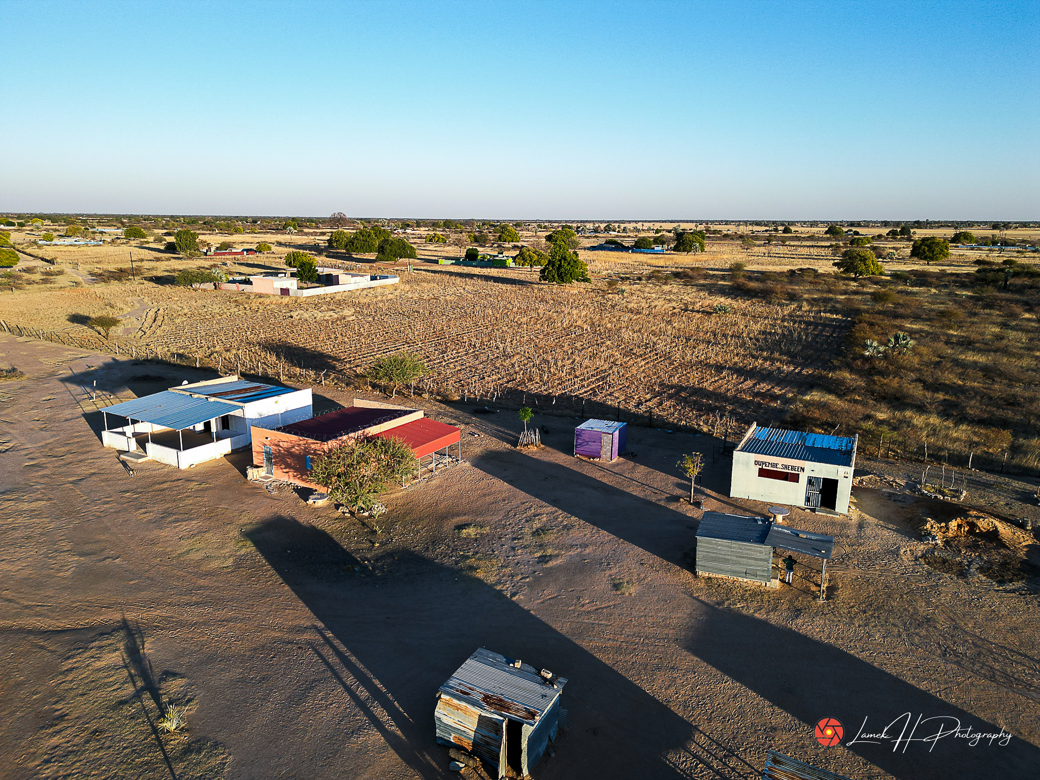 Aerial capture of a safari lodge surrounded by wildlife in Namibia